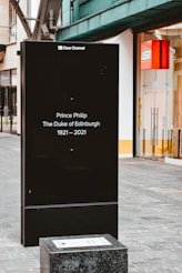 black and white signage on gray concrete floor