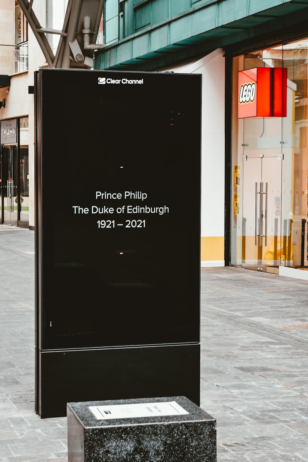 black and white signage on gray concrete floor