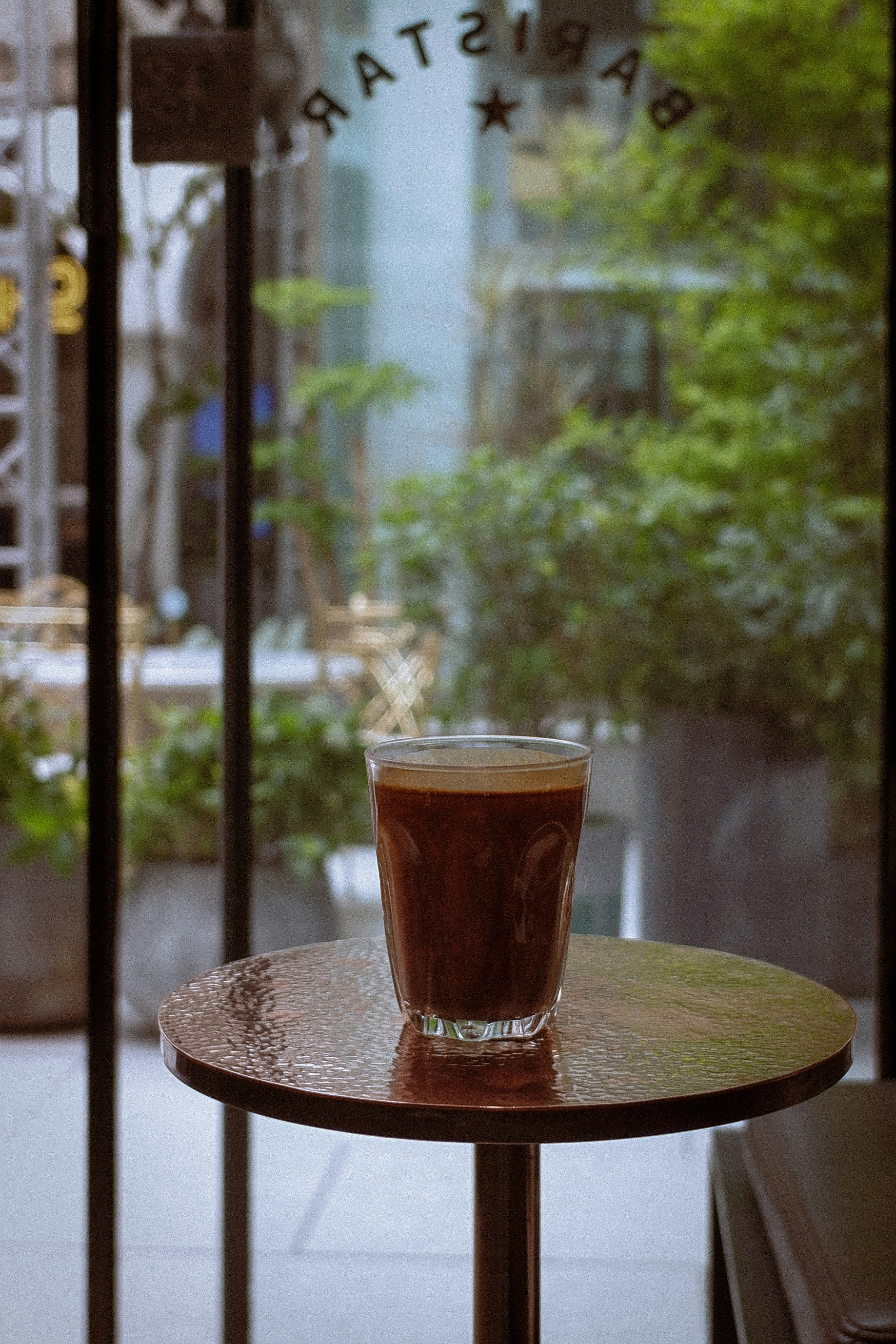 clear drinking glass on brown wooden table