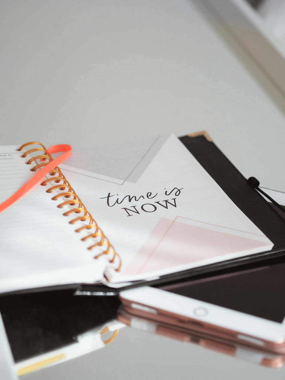 white ipad on white notebook