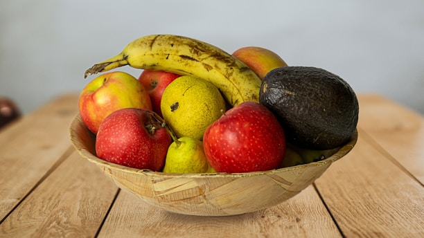 Close-up of vibrant Colombian tropical fruits arranged on a rustic wooden table.