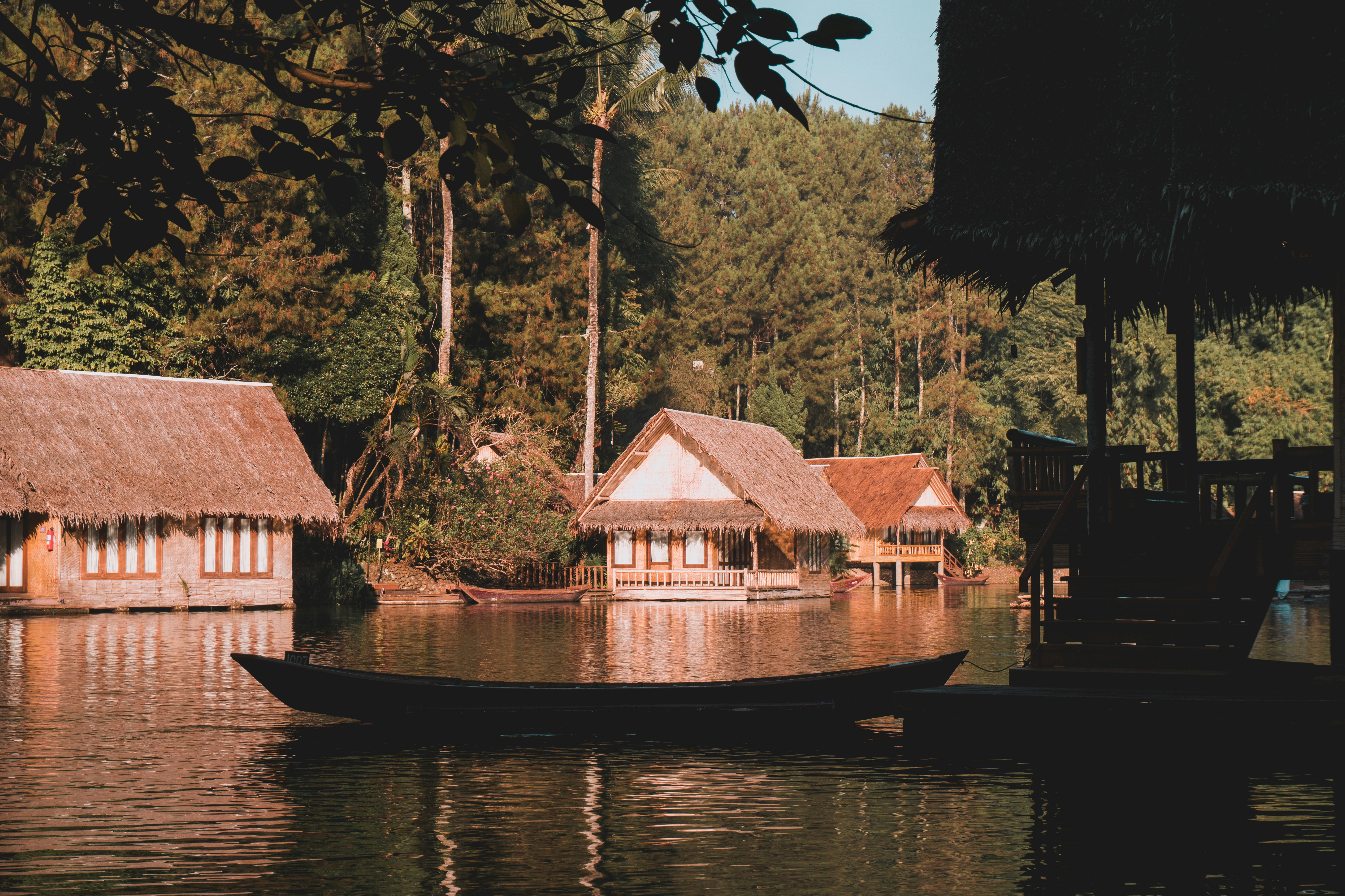 Brown wooden boat on river near green trees during daytime photo – Free ...