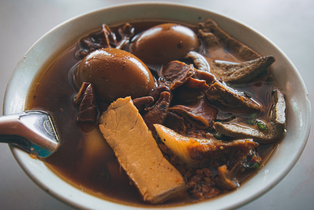 brown and black dish on white ceramic bowl