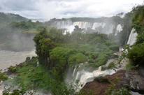 A stunning view of Victoria Falls with mist rising over the cascading water.
