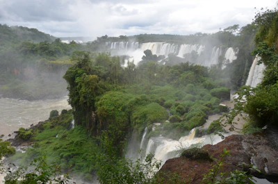 A stunning view of Victoria Falls with mist rising over the cascading water.