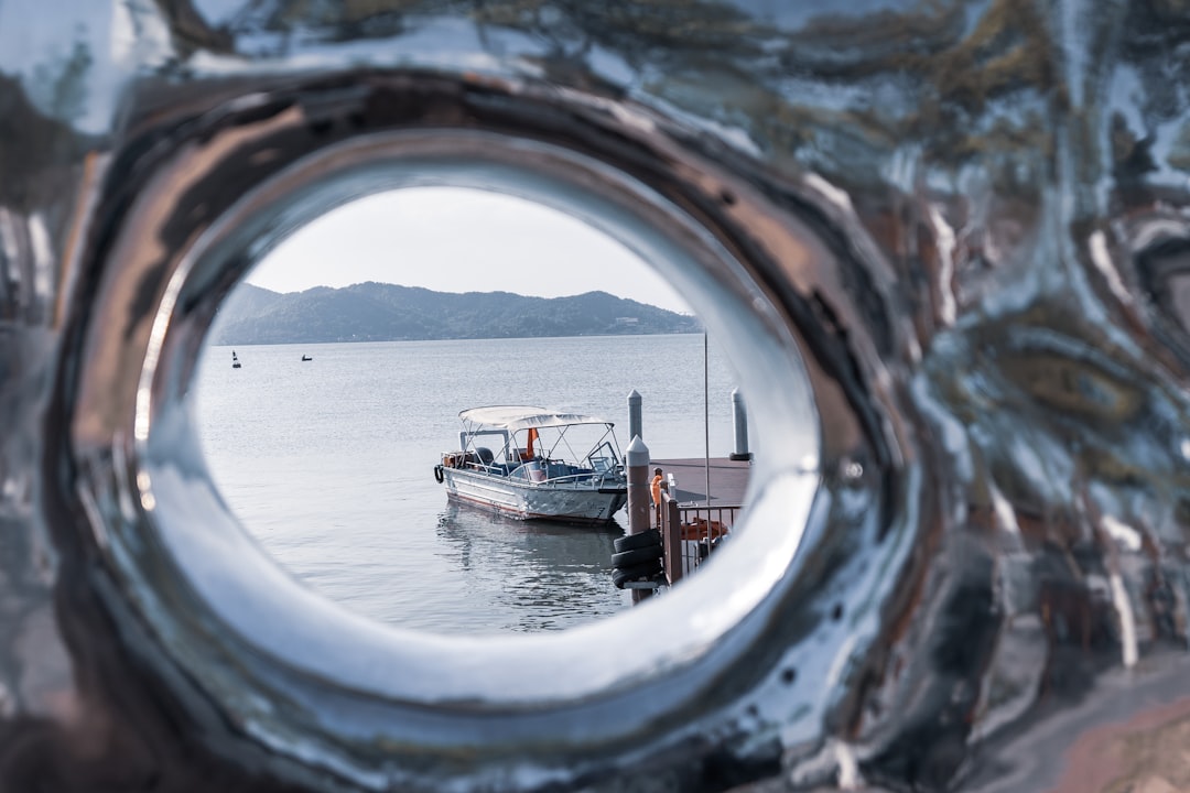 brown boat on body of water during daytime