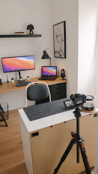 black flat screen tv turned on near black and gray speaker