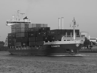 cargo ship on dock during daytime
