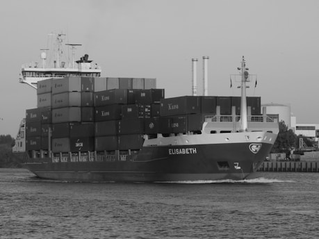 cargo ship on dock during daytime