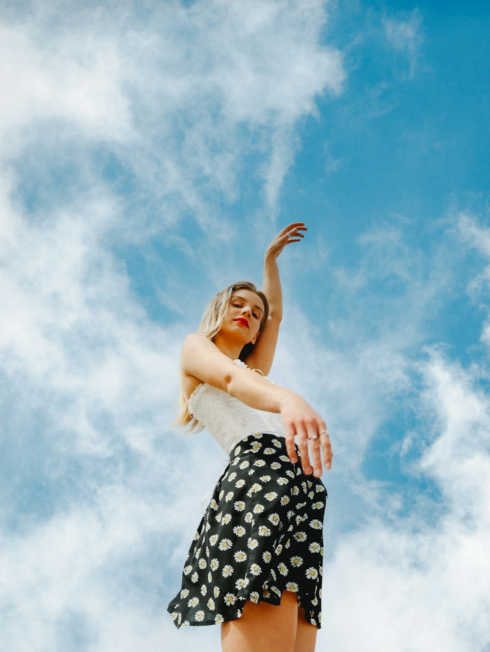 woman in black and white polka dot tube dress