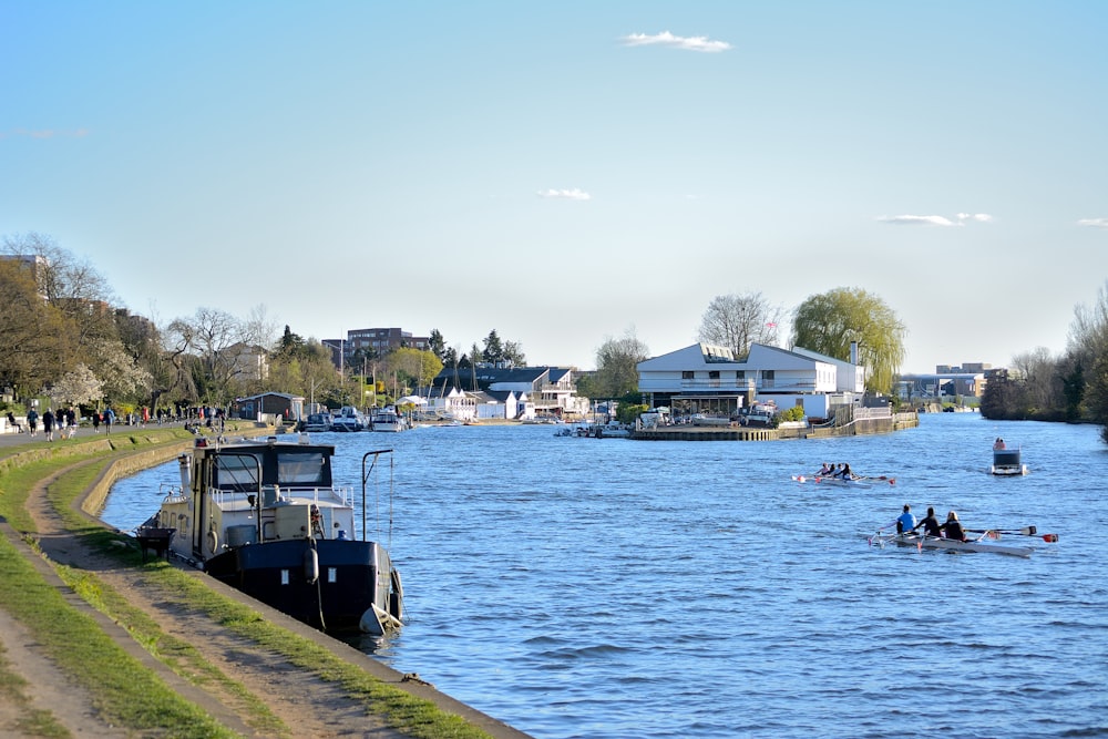 boat on water near houses during daytime