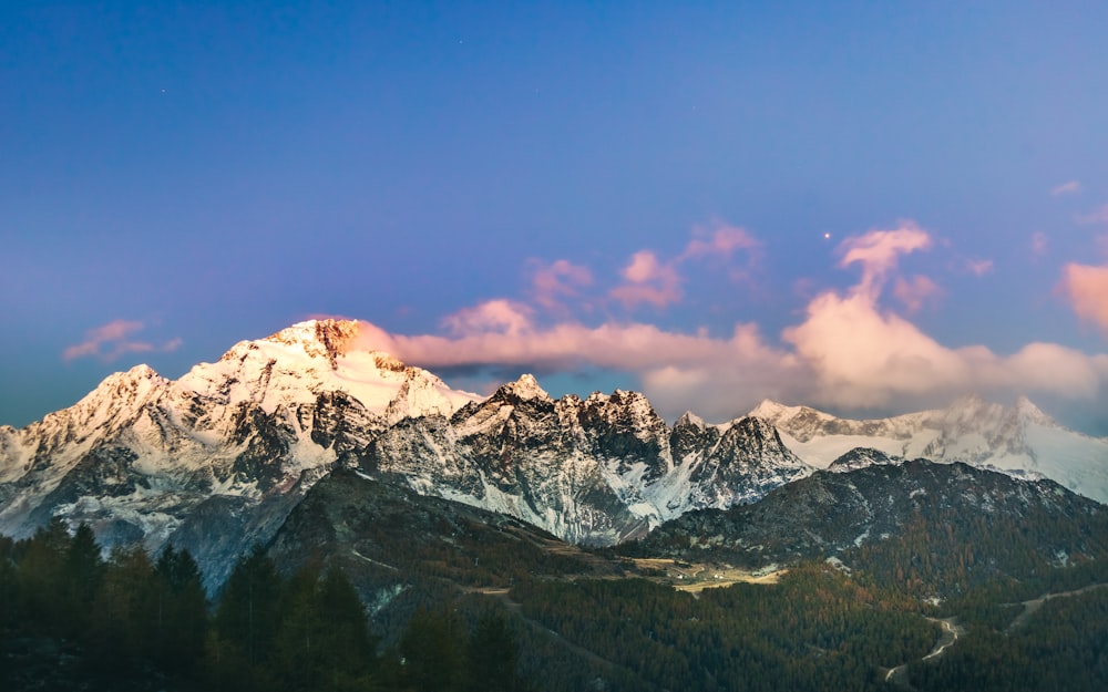 snow covered mountain under blue sky during daytime