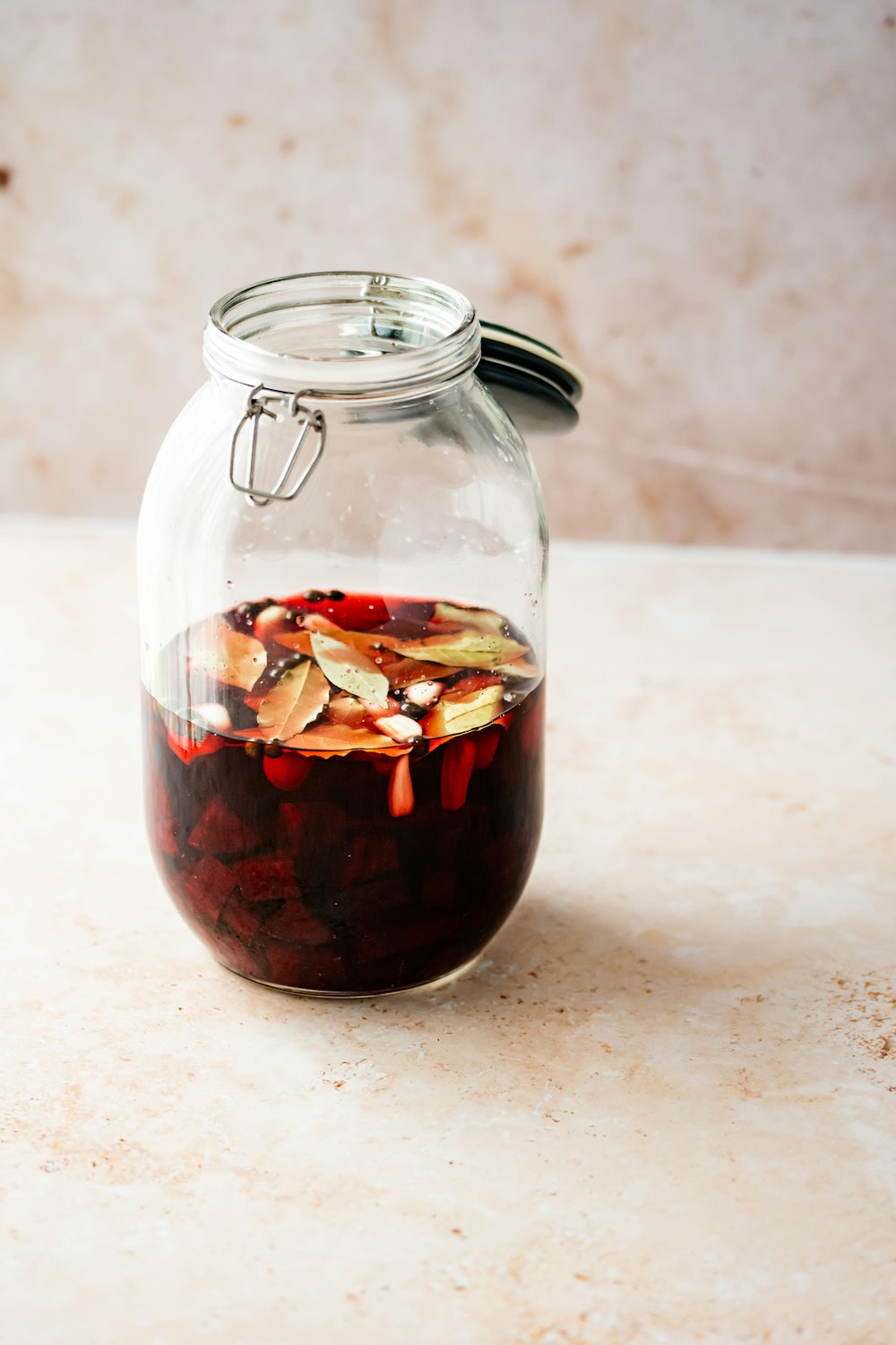 clear glass jar with red liquid