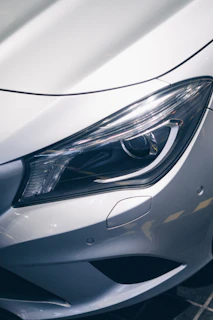 Close-up of a sleek Porsche facelifted with modern headlights and a redesigned bumper.