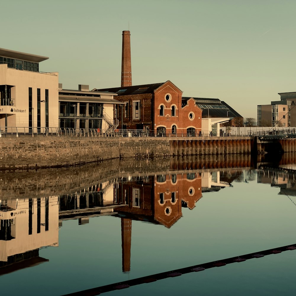 brown concrete building near body of water during daytime