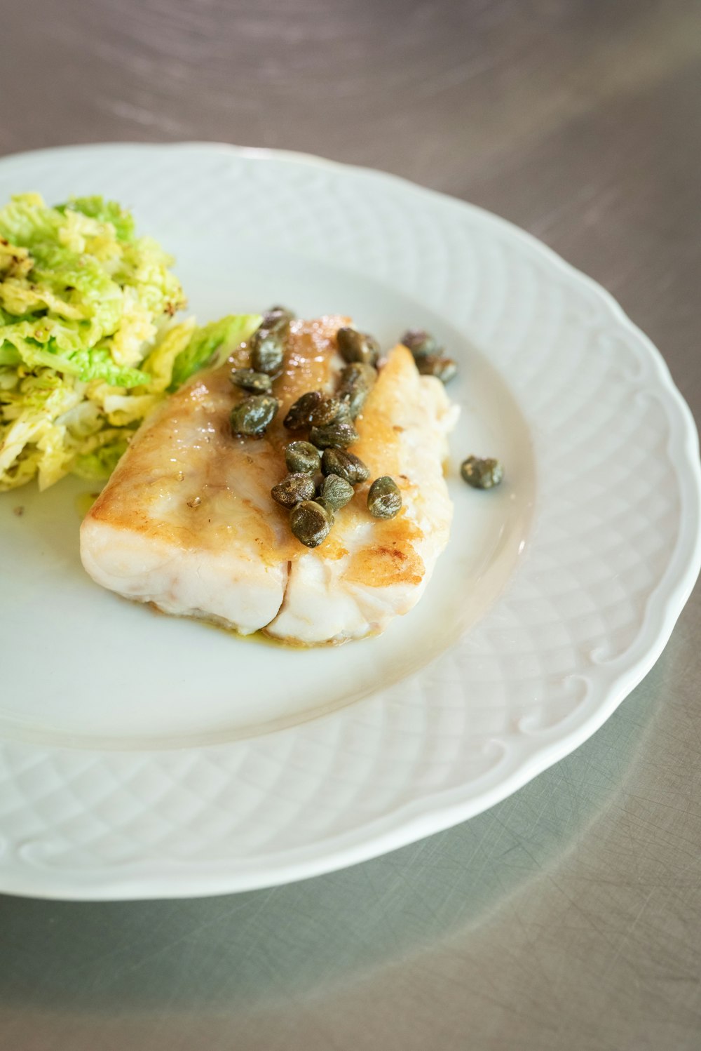 green vegetable on white ceramic plate