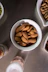 brown almond nut on white ceramic bowl