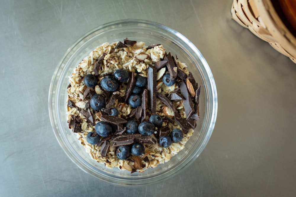 black and brown round beads in clear plastic container