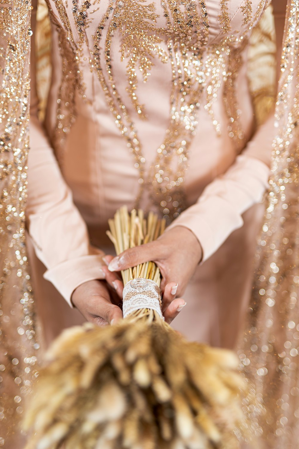 woman in white long sleeve dress wearing gold and gold beaded necklace