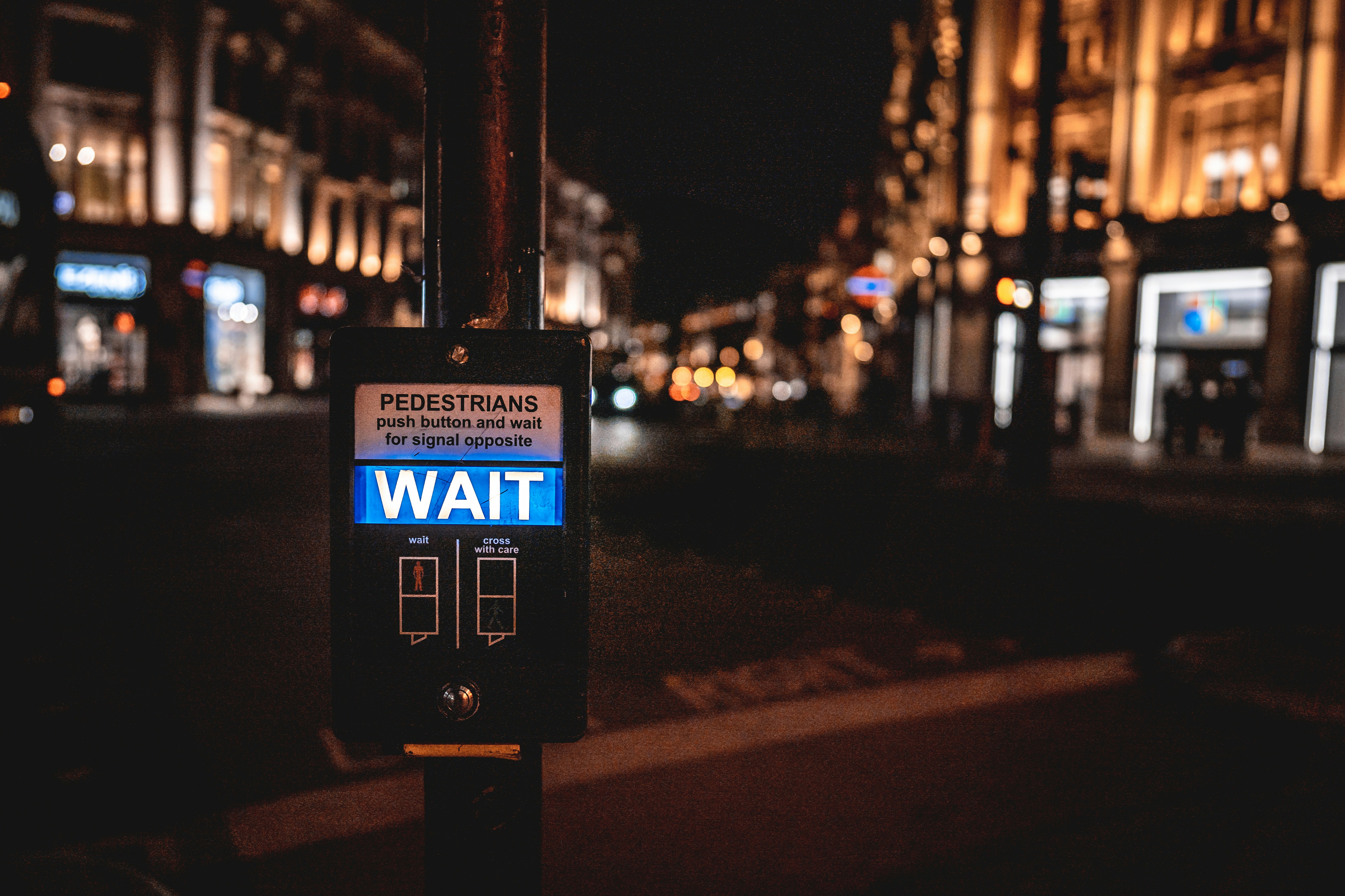a sign on a pole on a city street