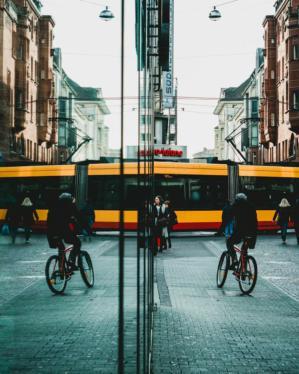 yellow and black bus on road during daytime