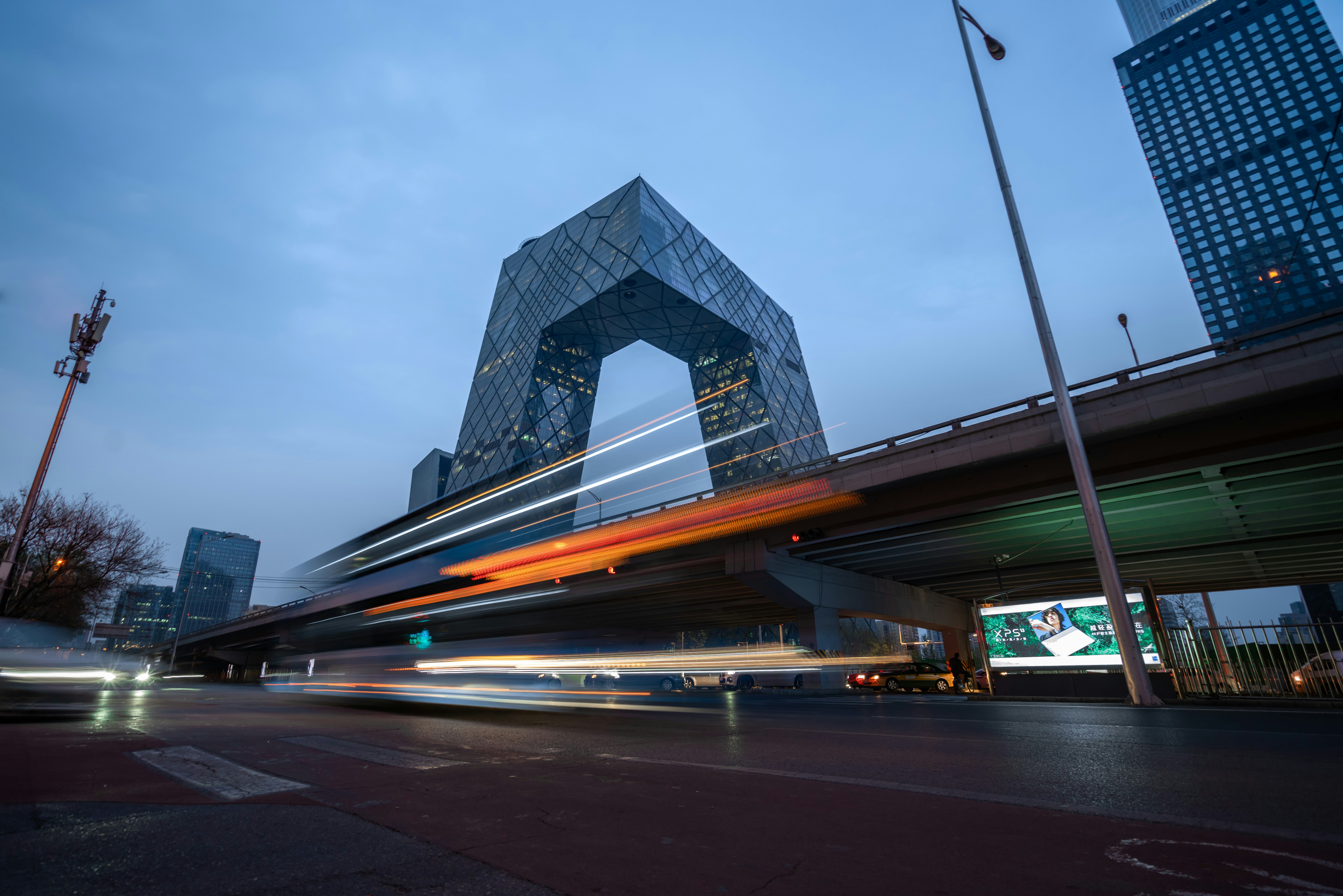 time lapse photography of cars on road near building during daytime