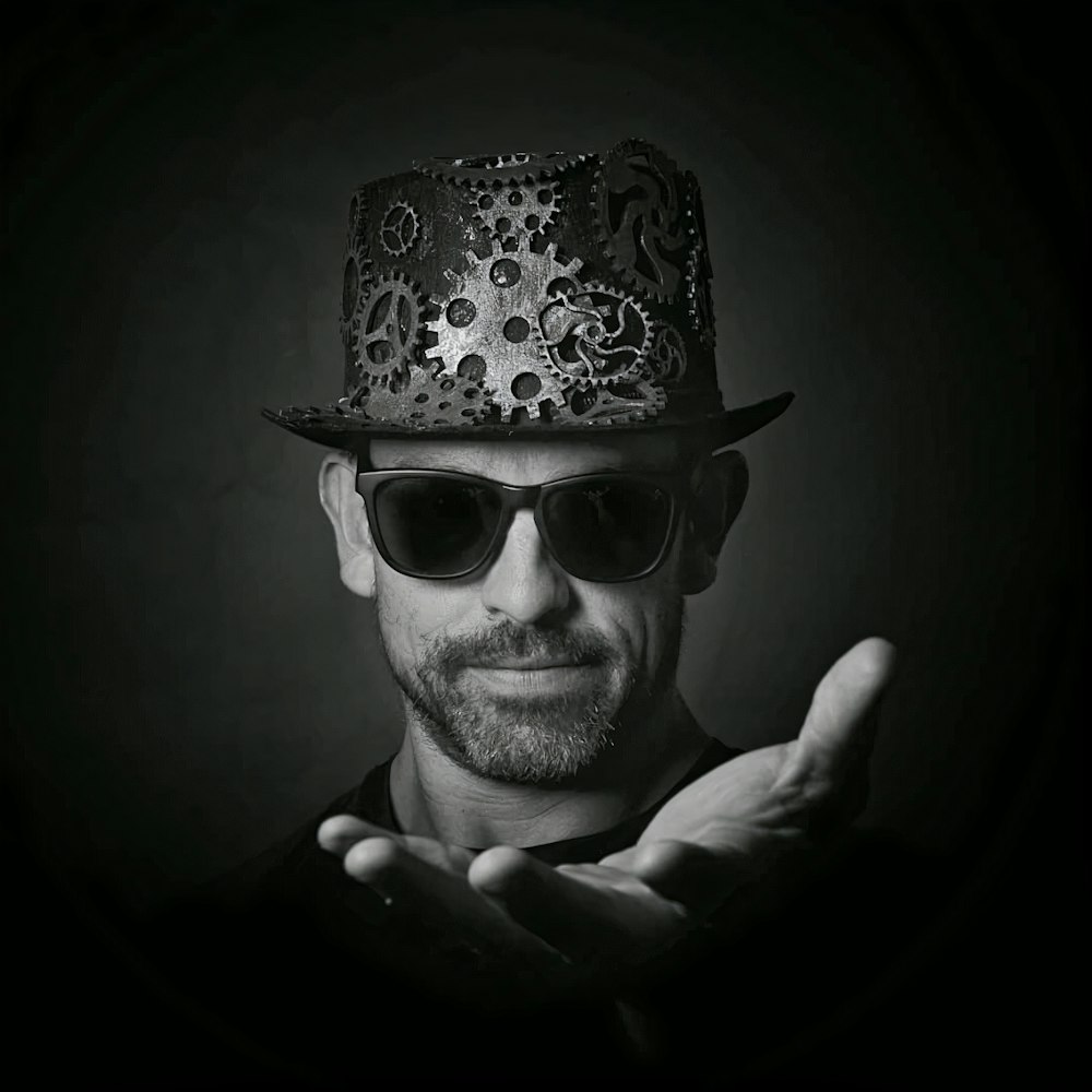 man wearing black sunglasses and hat
