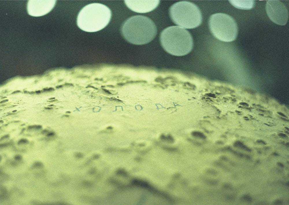 yellow powder in blue and white polka dot container