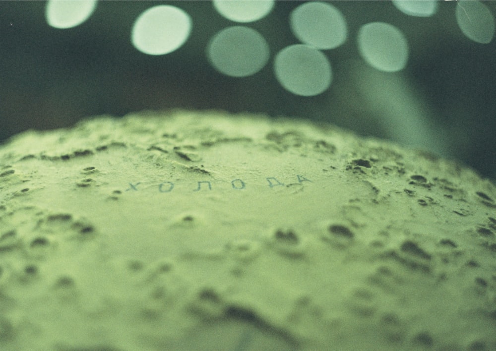 yellow powder in blue and white polka dot container