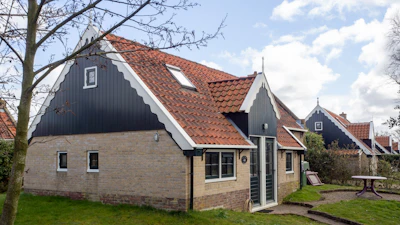 A charming traditional house with a tiled roof and courtyard.