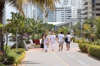Residents enjoying a morning walk on the landscaped garden pathway.