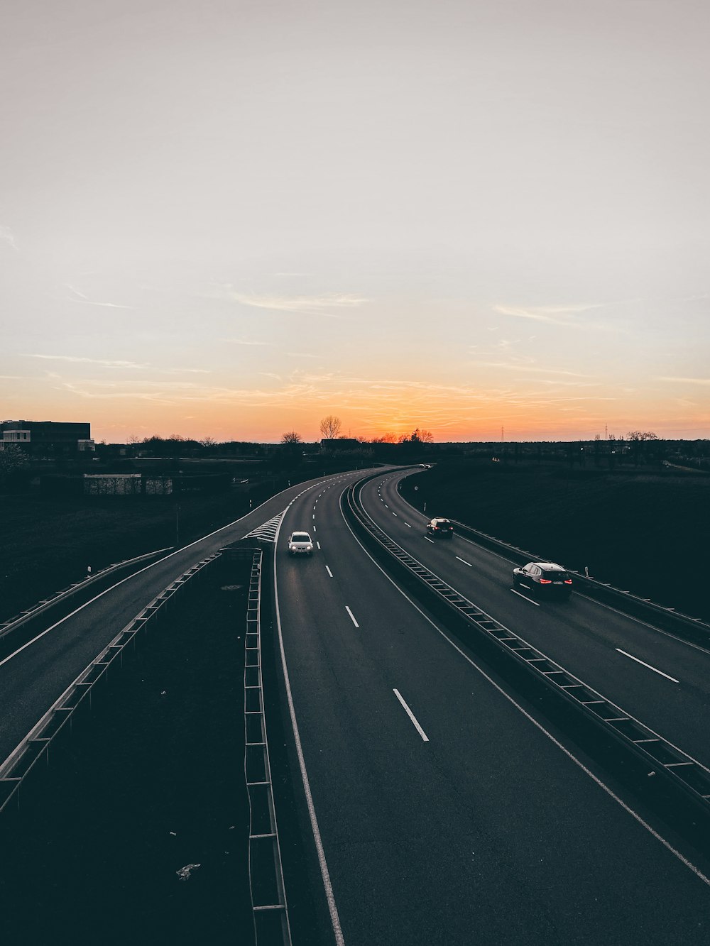 cars on road during sunset