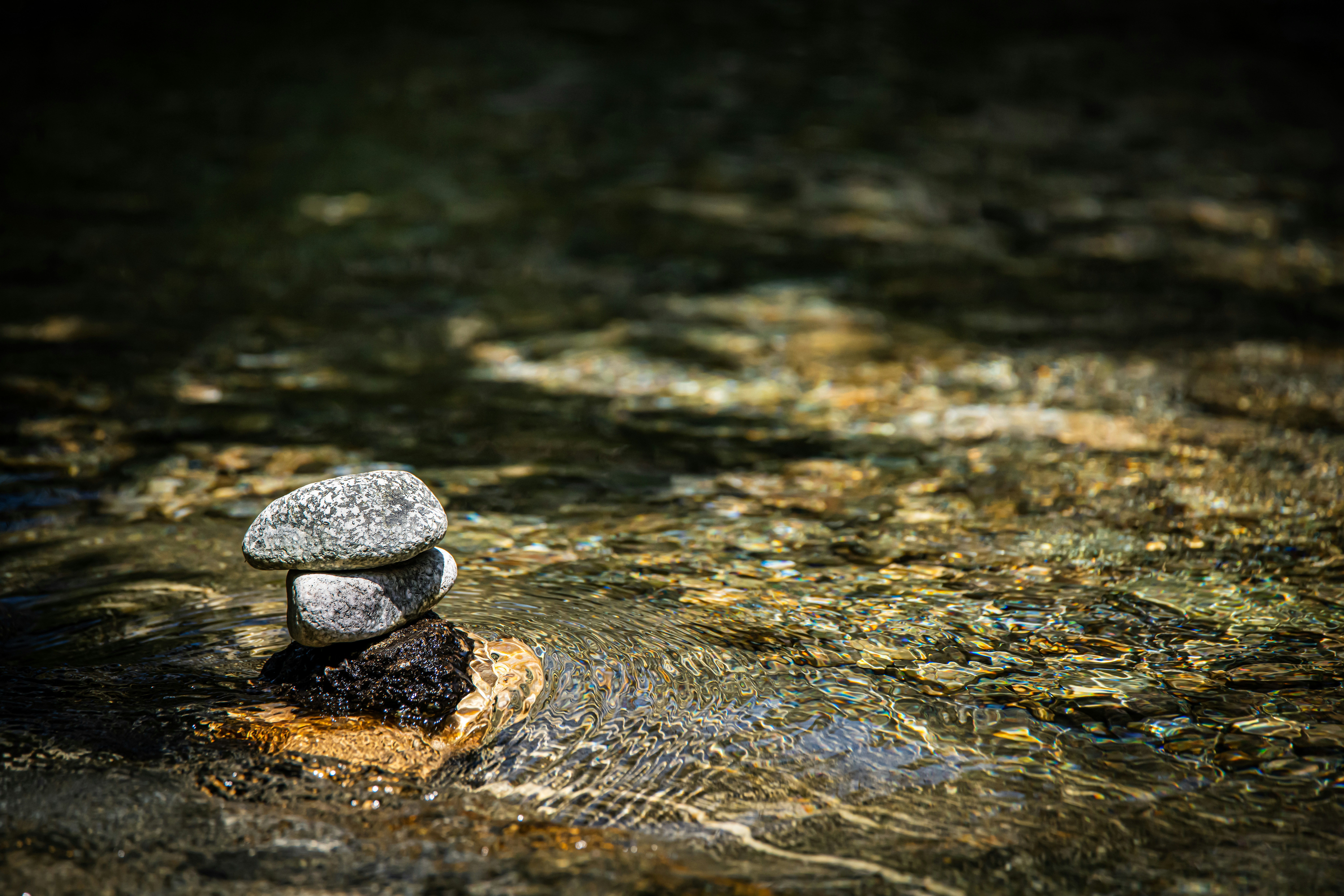 Zen rock tower in stream
