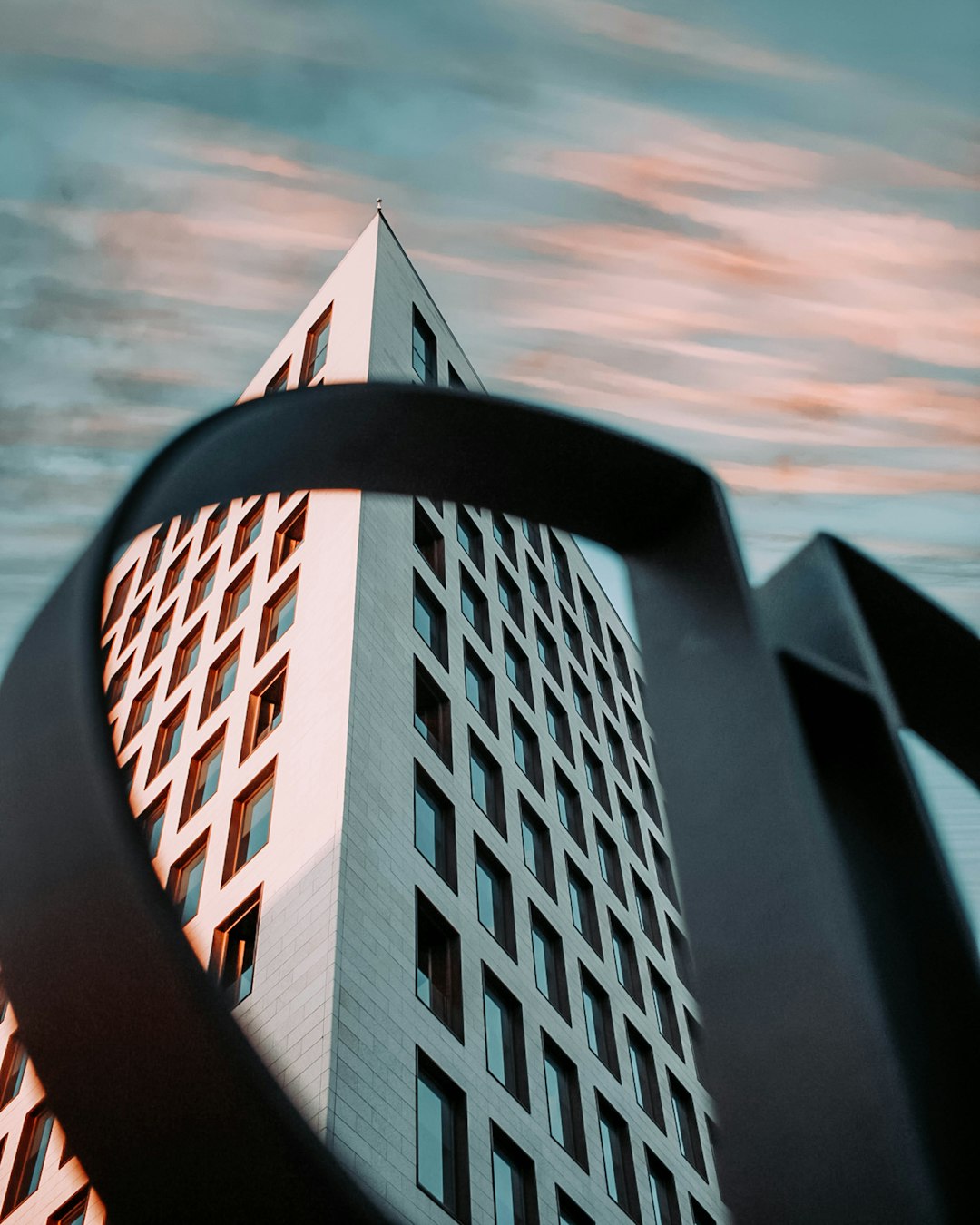 brown concrete building under cloudy sky during daytime