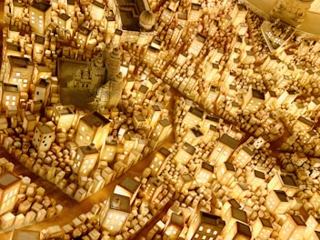 Detailed cityscape building blocks featuring tiny streets and buildings under warm lighting.