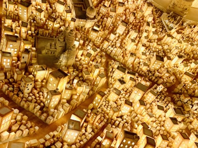 A colorful city-building game scene bustling with tiny animated citizens.