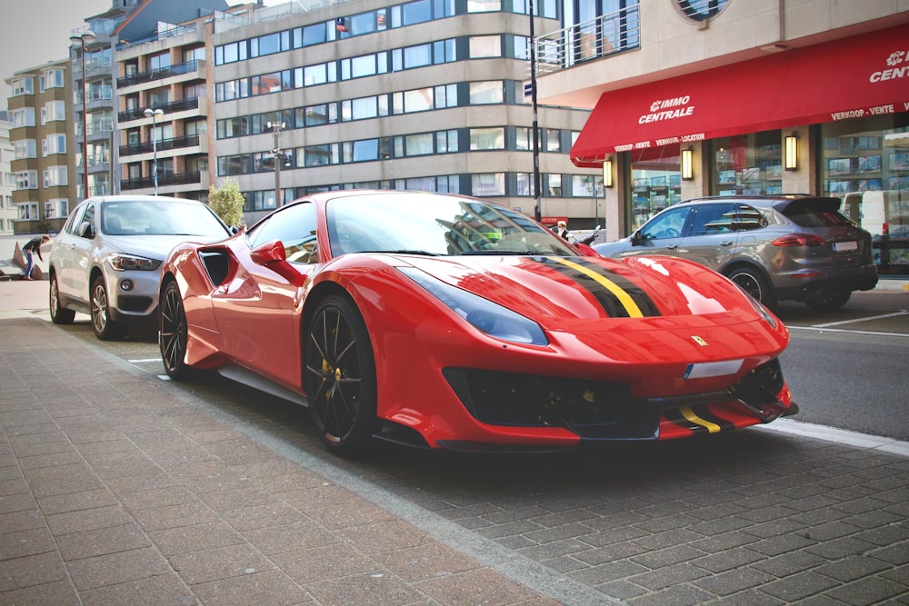 red ferrari 458 italia parked on street