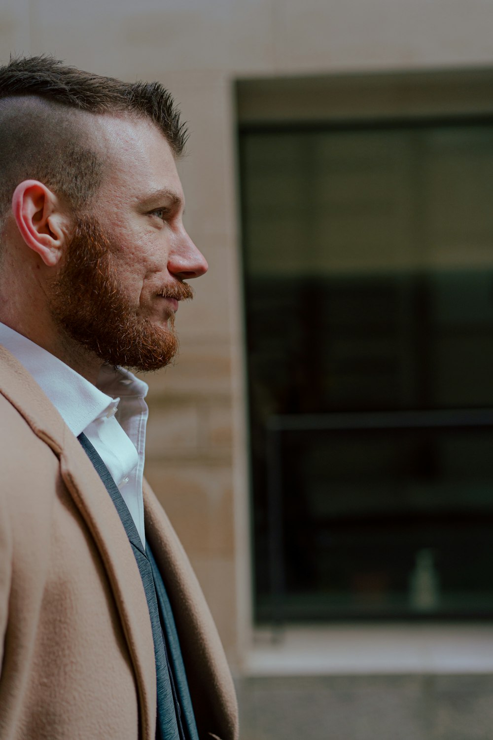 man in brown suit jacket