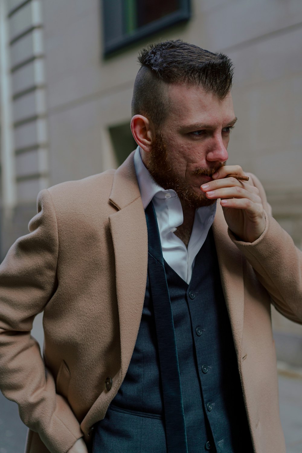man in brown suit jacket