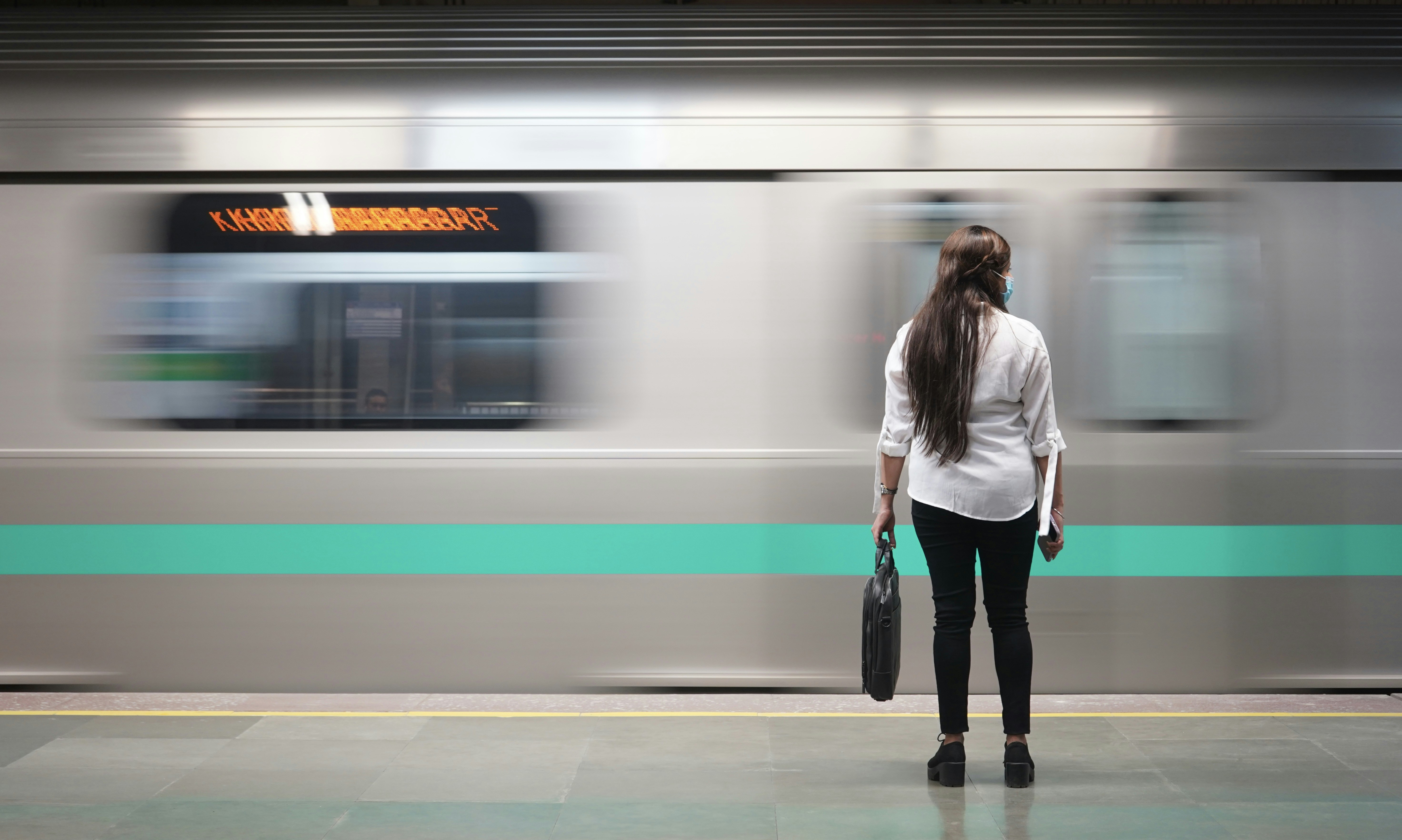great photo recipe,how to photograph metro; woman in white jacket standing beside train