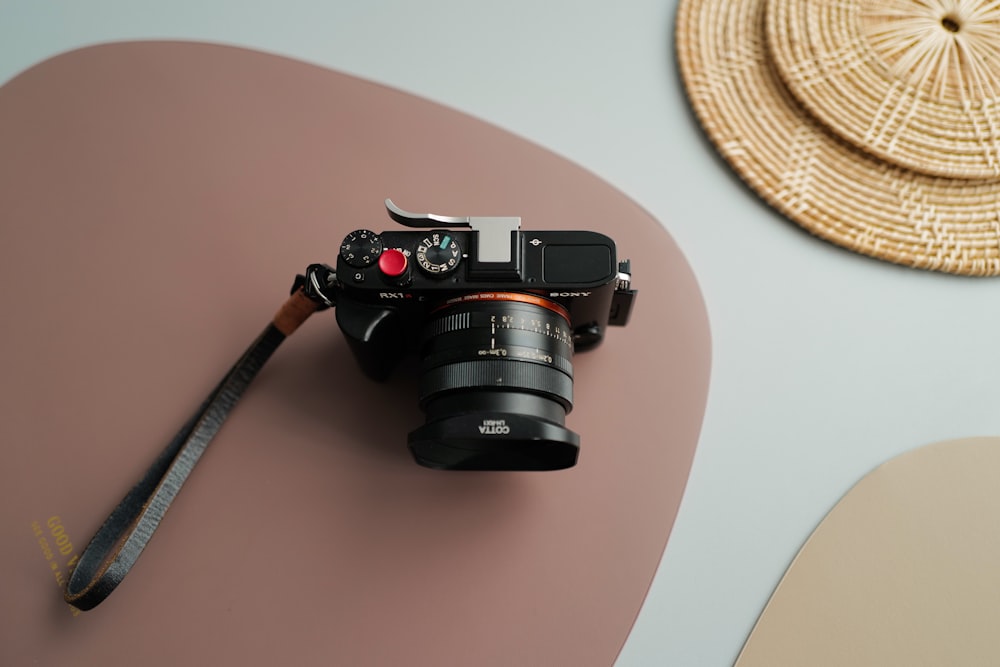 black nikon dslr camera on white table