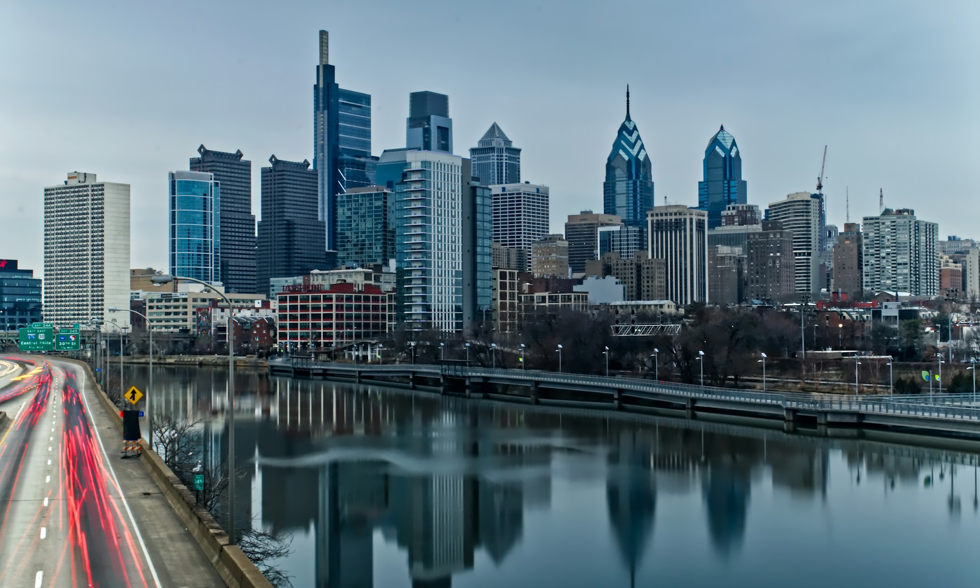 body of water near city buildings during daytime