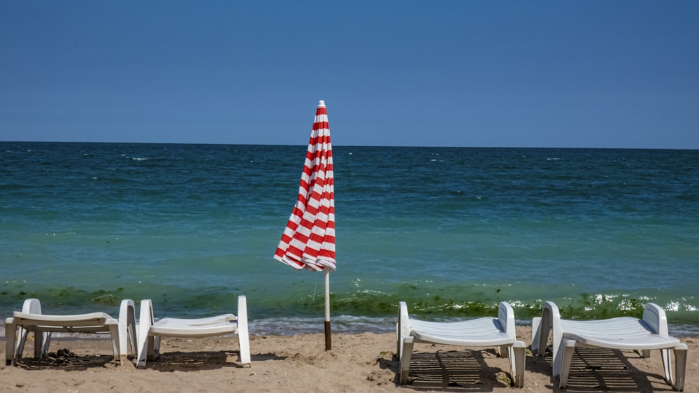 white wooden armchair on beach shore during daytime