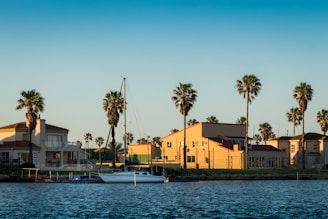 yellow concrete building beside body of water during daytime