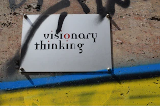 a sign that is on the side of a wall