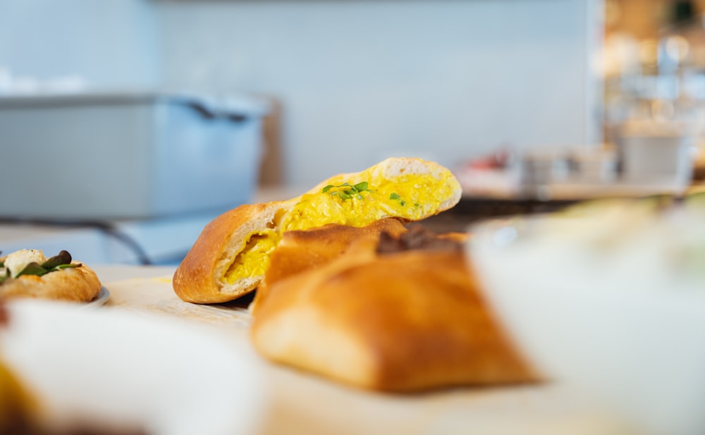 bread with green vegetable on white ceramic plate