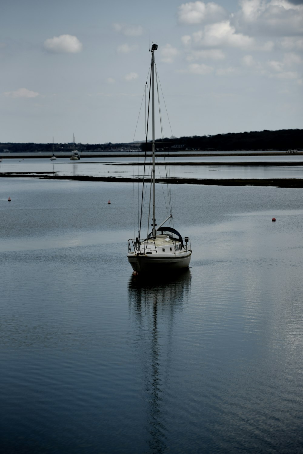 white and black boat on sea during daytime