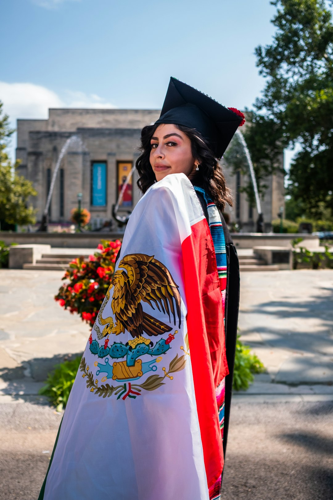 woman in white red and blue kimono standing on gray concrete floor during daytime