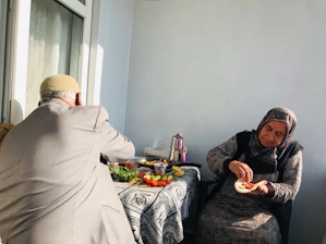 An elderly couple enjoying a healthy meal together at home.