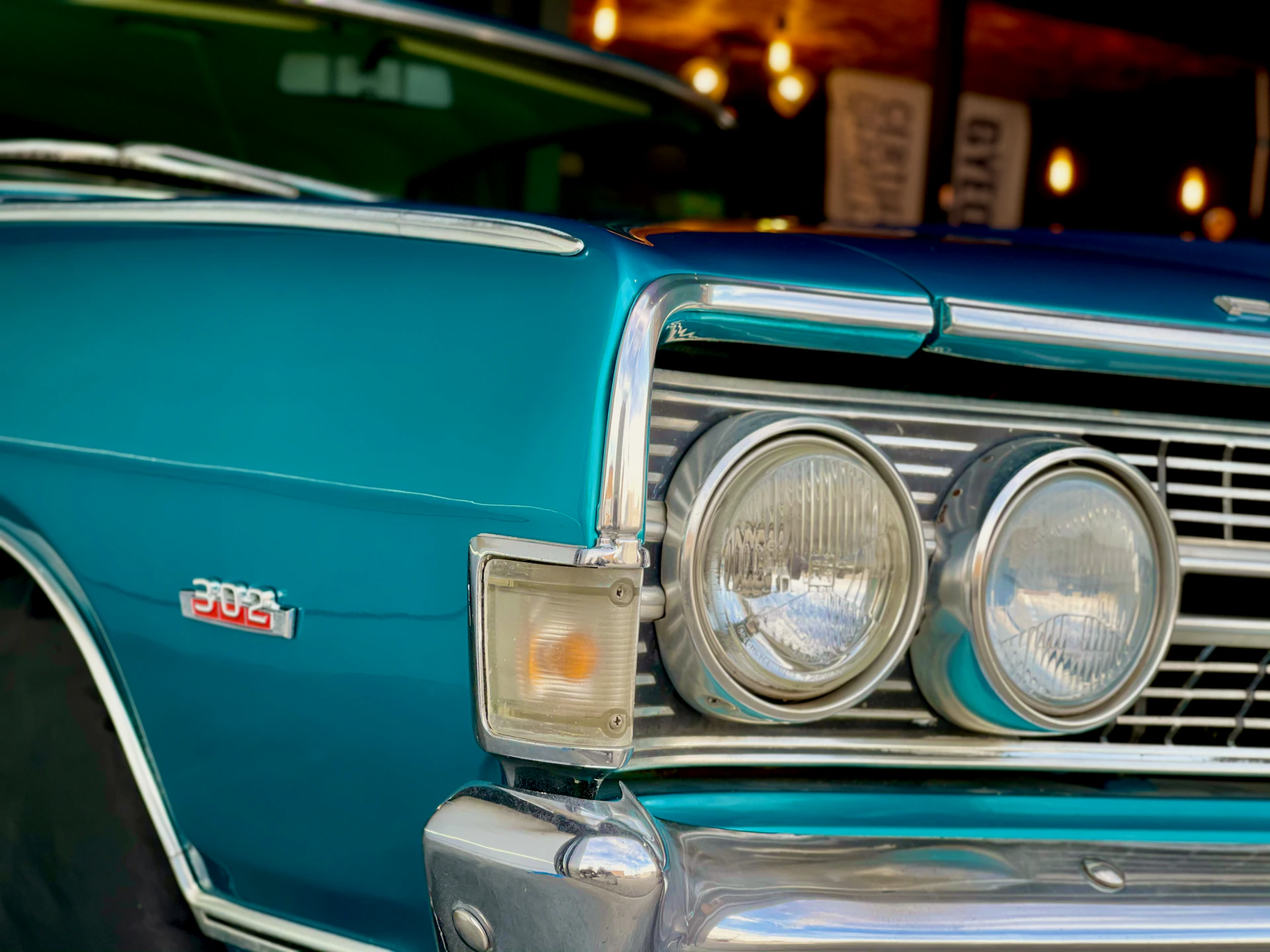 blue car with silver and gold headlight